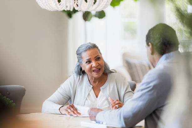 istock Mature Woman Discussing Financial Planning with Advisor 2198213489