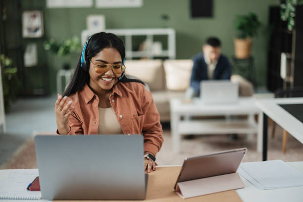 istock Enthusiastic Woman Connecting with Colleagues 2198214119