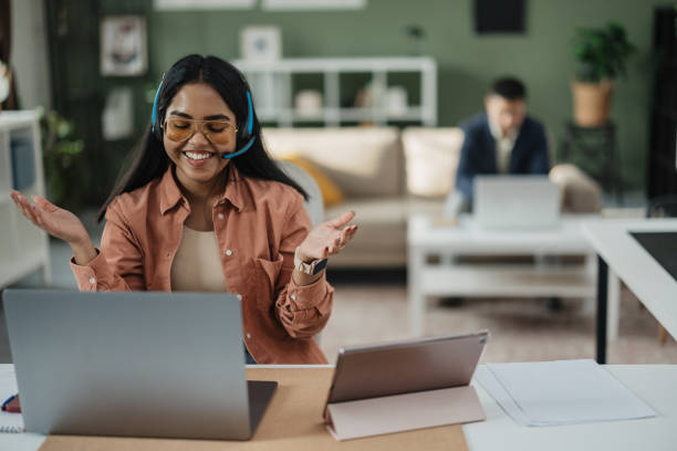 Cheerful Young Woman Gesturing in Modern Office