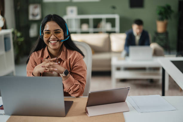 istock Happy Woman with Headset in Casual Office 2198214234