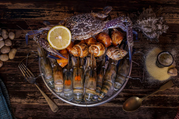 istock Fresh Seafood Platter Blue Crab River Prawns and Spotted Babylon with Lemon 2198214397