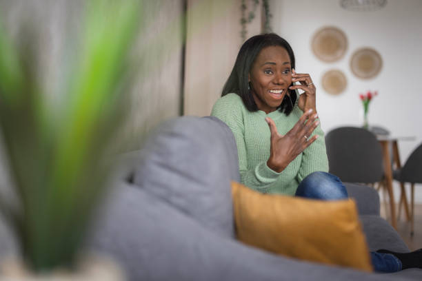 istock Beautiful woman having casual phone conversation 2198218397