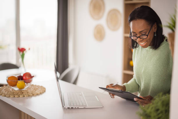 istock Happy business woman reading documentation 2198218484