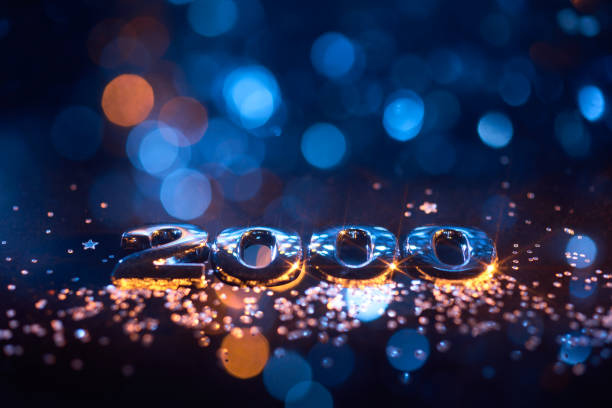 istock Shimmering Metallic 2000 Text with Glittering Particles and Blue Bokeh Lights for Y2K-Themed Designs 2198218746
