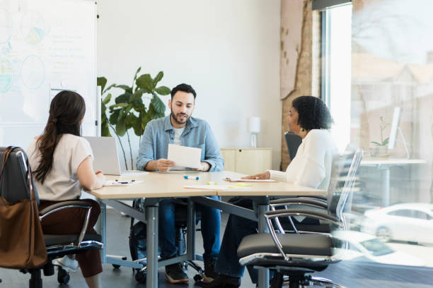 istock Multiracial Group Meeting in Modern Office, Discussing Business 2198220594