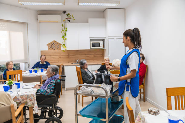 istock Caring for seniors in a nursing home dining area 2198220722