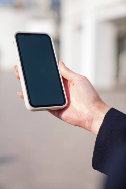 istock Close up or woman using smart phone 2198220740
