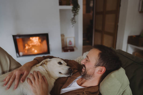 istock Enjoying together by the fireplace 2198220879