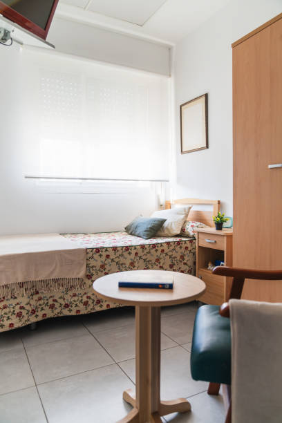 istock Cozy geriatric nursing home room interior 2198221986