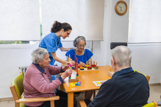 istock Seniors engaging in activities at nursing home 2198222023