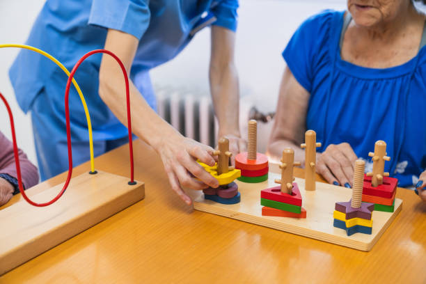 istock Engaging seniors with cognitive activities in nursing home 2198222035