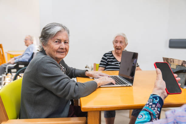 Seniors engaging with technology in nursing home