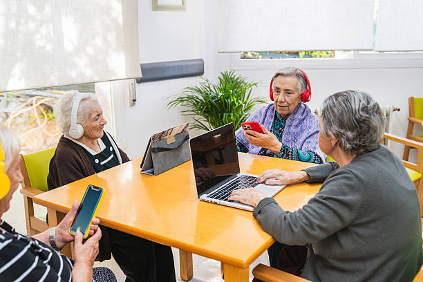 istock Seniors engaging with technology in nursing home 2198222225