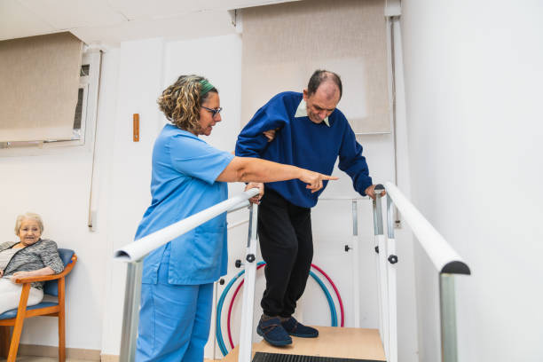 istock Elderly man receiving assistance in nursing home 2198222303