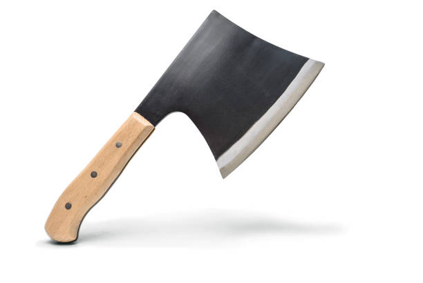 Old, used axe head close up with soil and rust blade. Heavy, dangerous tool used for chopping wood and other large objects. Isolated on white background.