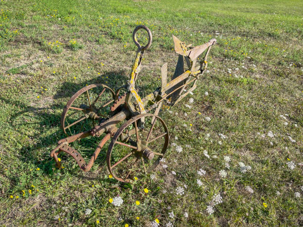 istock a rusty old semi tillage and ploughing machine, abandoned in a green meadow, old rural implements and agriculture tools 2198227139