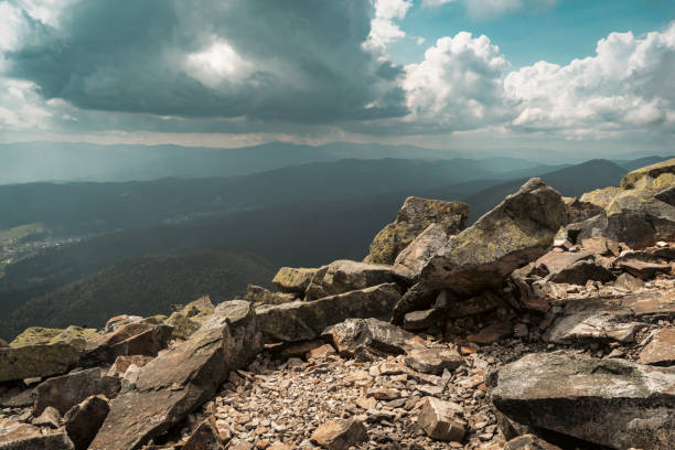 istock A stunning view of the mountain horizon beneath a bright blue sky dotted with clouds. 2198229418