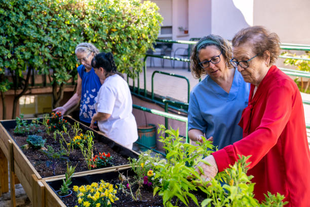 istock Seniors engaging in therapeutic gardening activities 2198230212