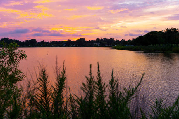 Mount Trashmore Summer sunset over water in Virginia Beach Virginia