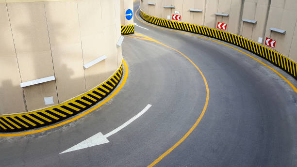 istock Road with a yellow and black striped barrier 2198233706