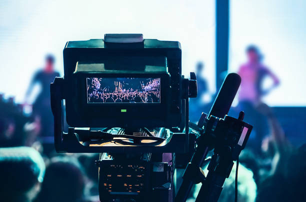 istock Camera is pointed at a crowd of people 2198233951