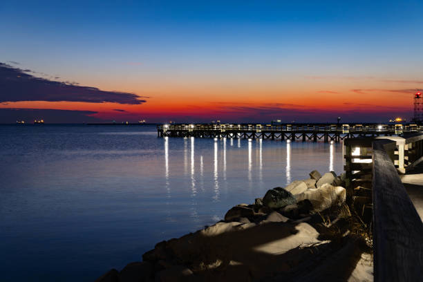 istock Cape Charles Beach Winter Sunset over water in Virginia 2198234861