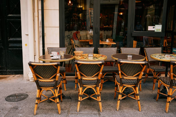 Paris, France - 20.02.2024. Le Flore en l'Île French restaurant located at Quai d'Orléans in Paris, France. Ile Saint Louis. Spring in Paris. Famous cafe or brasserie with tables outside.