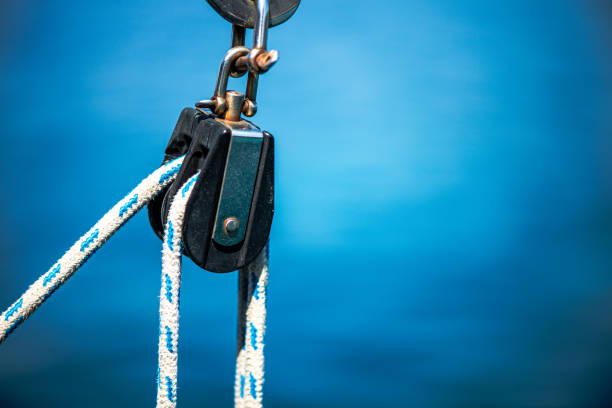 istock Strength and Precision: Knot and Winch on a Ship with Blue Water Background 2198237068