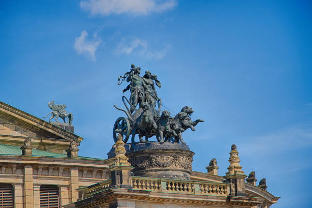 istock DRESDEN, GERMANY. Quadriga sculpture on the Semperoper building exterior by Johannes Schilling. . 2198237393