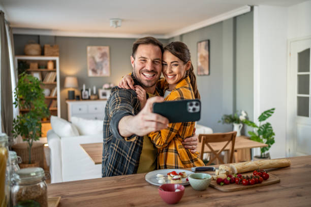 istock Joyful couple taking a selfie while enjoying bruschettas 2198250736