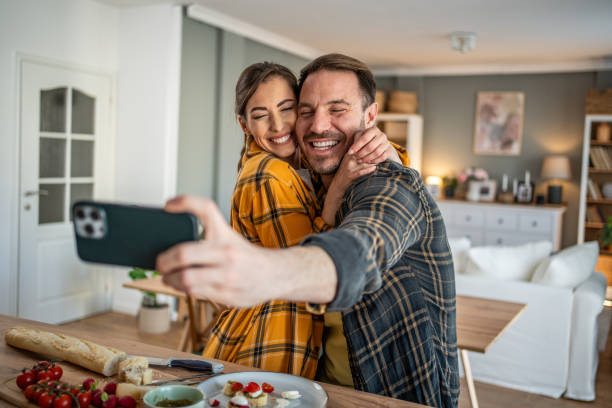 istock Joyful couple taking a selfie while enjoying bruschettas 2198250738