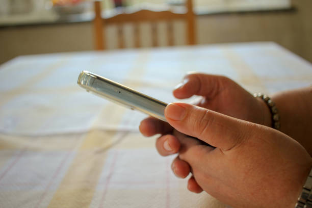 watching social media at home on a smartphone after lunch