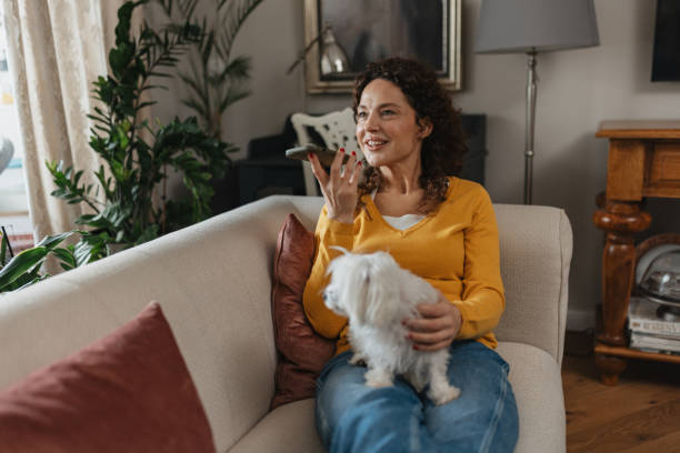 istock Woman Smiling While Speaking on Phone 2198270366
