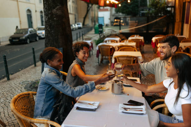 istock Friends Enjoying Dinner at Outdoor Restaurant 2198272591