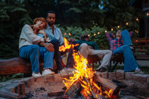 istock Friends Relaxing by a Cozy Campfire Outdoors 2198272674