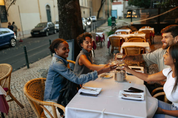 istock Friends Enjoying Dinner at Outdoor Restaurant 2198272679