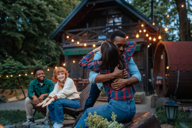 istock Young Adults Enjoying Time at Rustic Cabin 2198272684