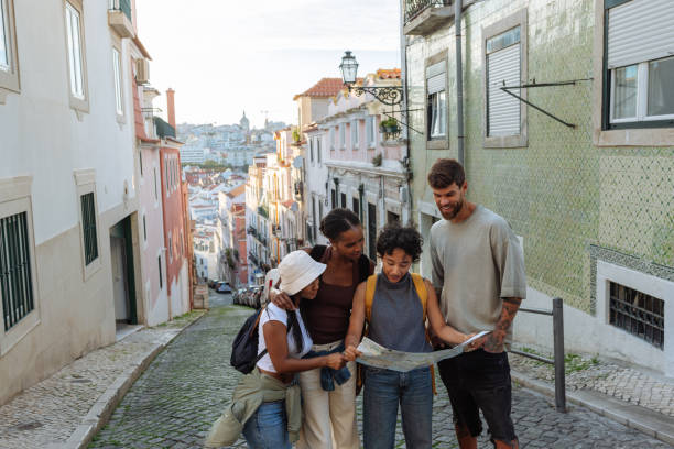 istock Group of Young Adults Exploring Lisbon Streets 2198272732