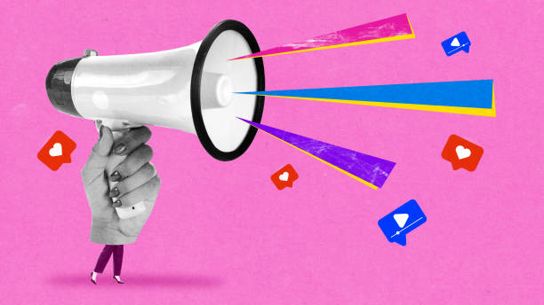 istock Virtual influence, advertisement, promotion. Hand holding giant megaphone with colorful heart icons and speech bubbles. 2198275638