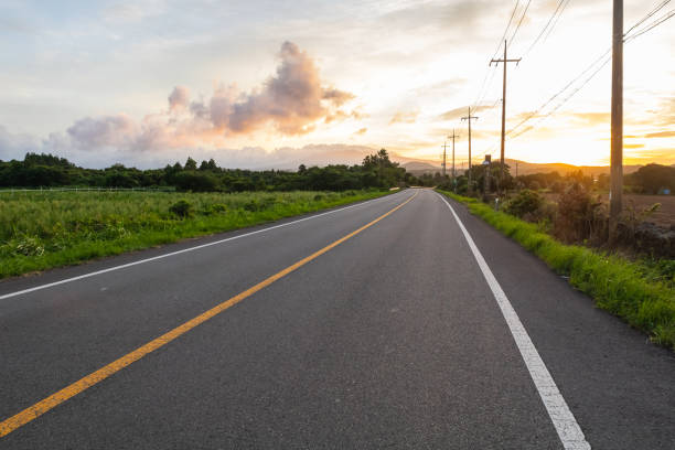 istock an asphalt road at sunset in the evening 2198275983