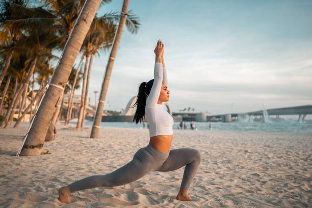 istock Hispanic Female Engaged in Beachfront Yoga at Sunset 2198278068