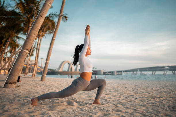 istock Hispanic Female in Yoga Pose on Beach at Sunset 2198278070