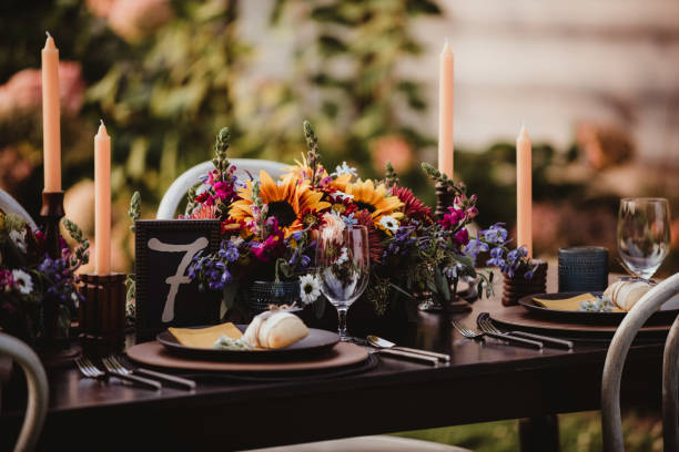 istock Close up of wedding reception dinner table set up with flowers and candles 2198287273