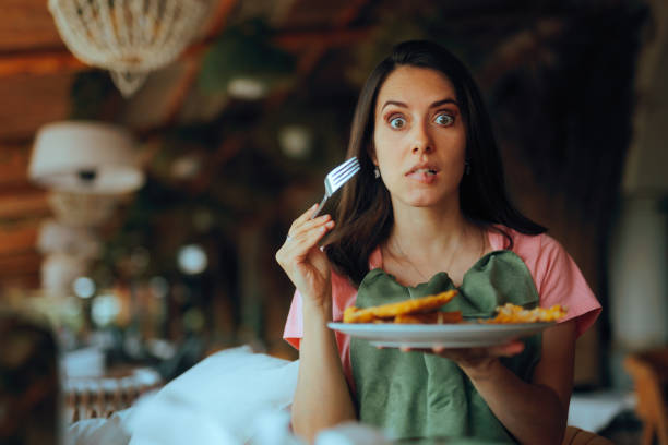 istock Funny Woman Looking Surprised with her Tasty restaurant Dish 2198290589