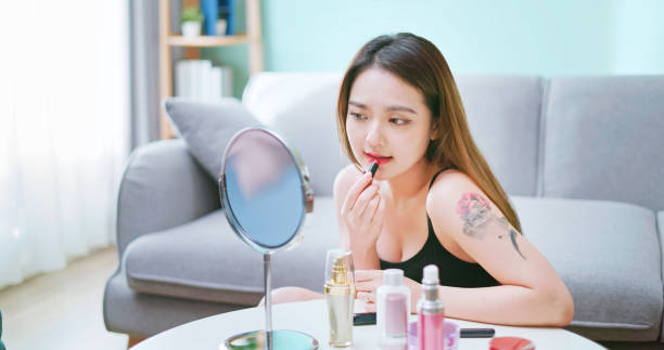 istock asian beauty apply lipstick 2198293240