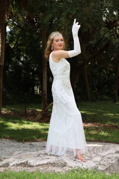 Beautiful young woman in a formal dress, posing, going to the graduation ceremony