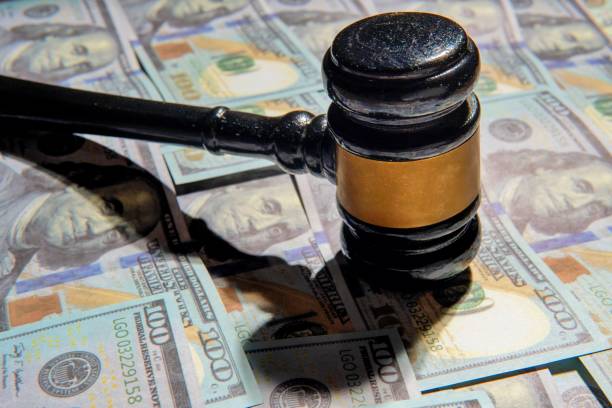 istock Closeup image of gavel and money. 2198294798