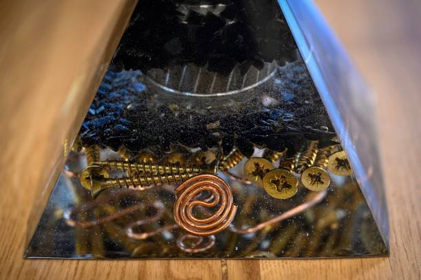istock High resolution image of a single isolated beautiful one of a kind hand made Orgone pyramid generator containing powerful crystals 2198306092