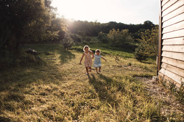 istock Beautiful children enjoying outdoors 2198306664