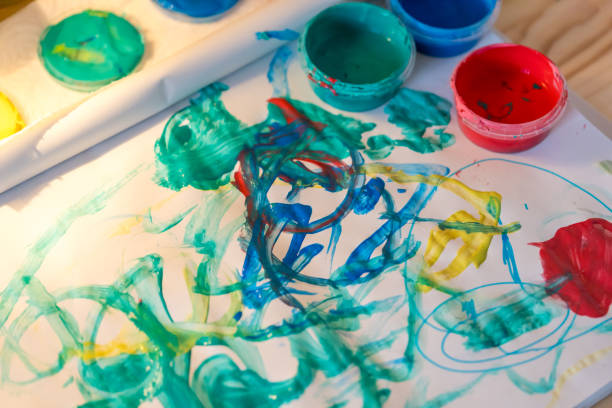 Close-up of a toddler's first attempts at painting